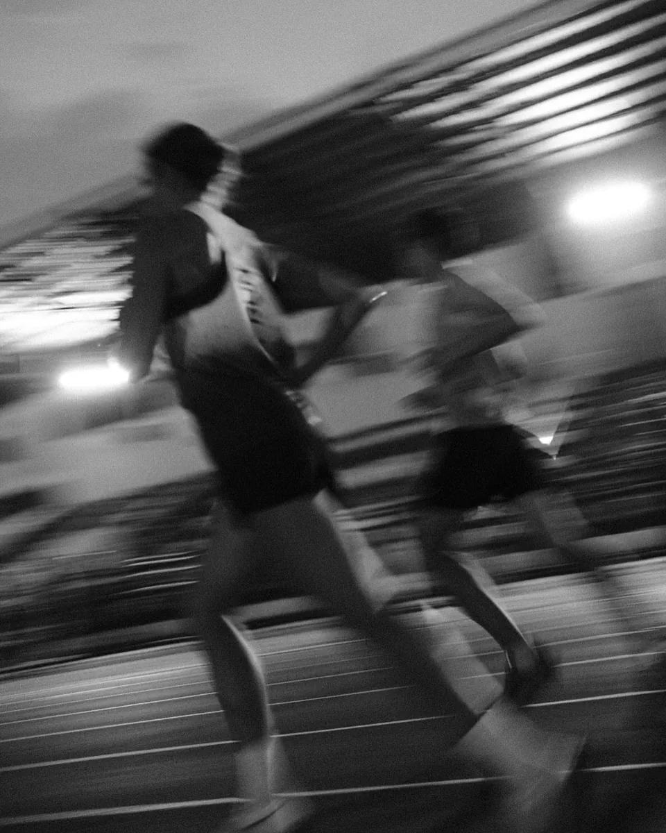 A runner in motion in an archive photograph with motion blur