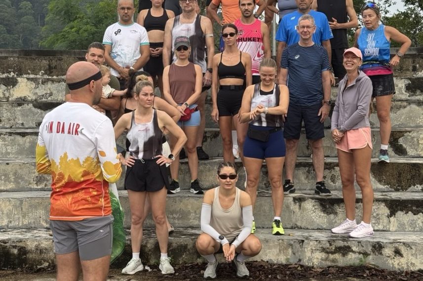 PHUKET RUN members gather at Bang Wad Dam beside the club flag